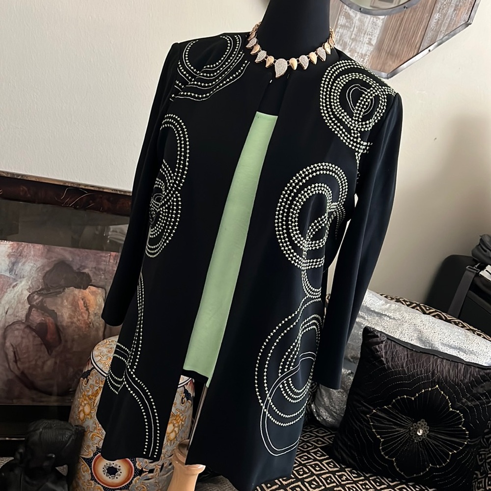 Sitting pretty in a beautiful Ming Wang jacket!